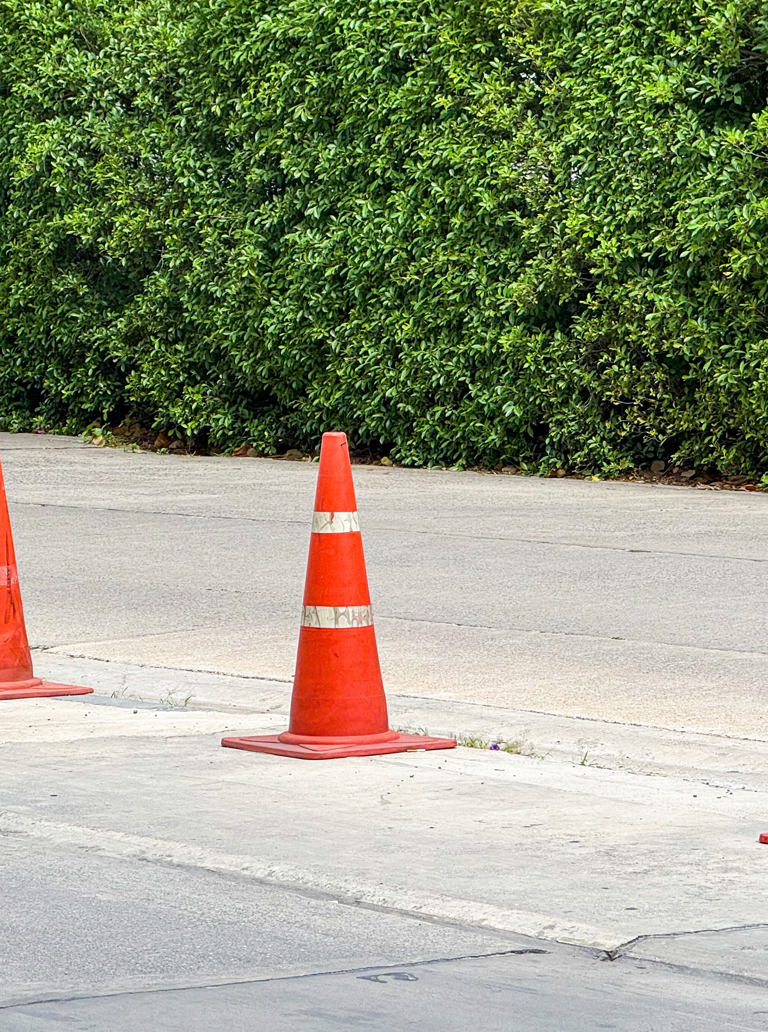 Traffic safety cones marking area for road line striping work