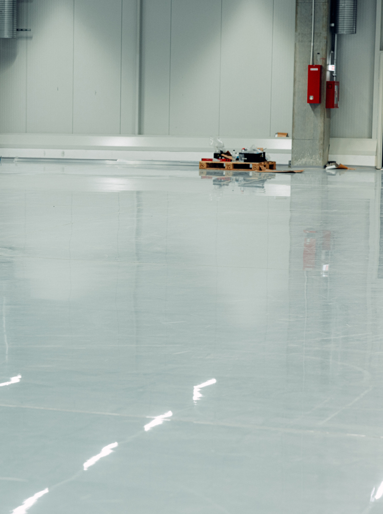 Polished epoxy floor coating in an industrial warehouse