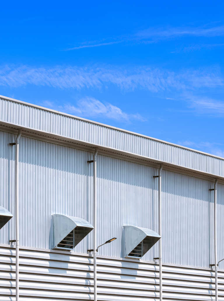 Industrial building exterior with fresh protective coating