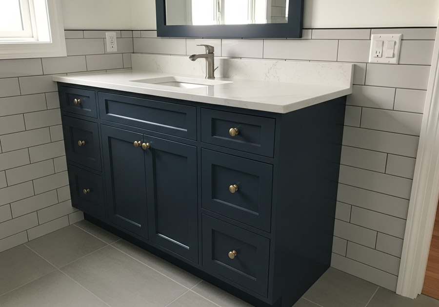 Painting a kitchen cabinet door with blue paint