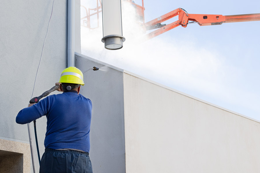 Professional commercial pressure washing on building exterior by Walls Master Toronto