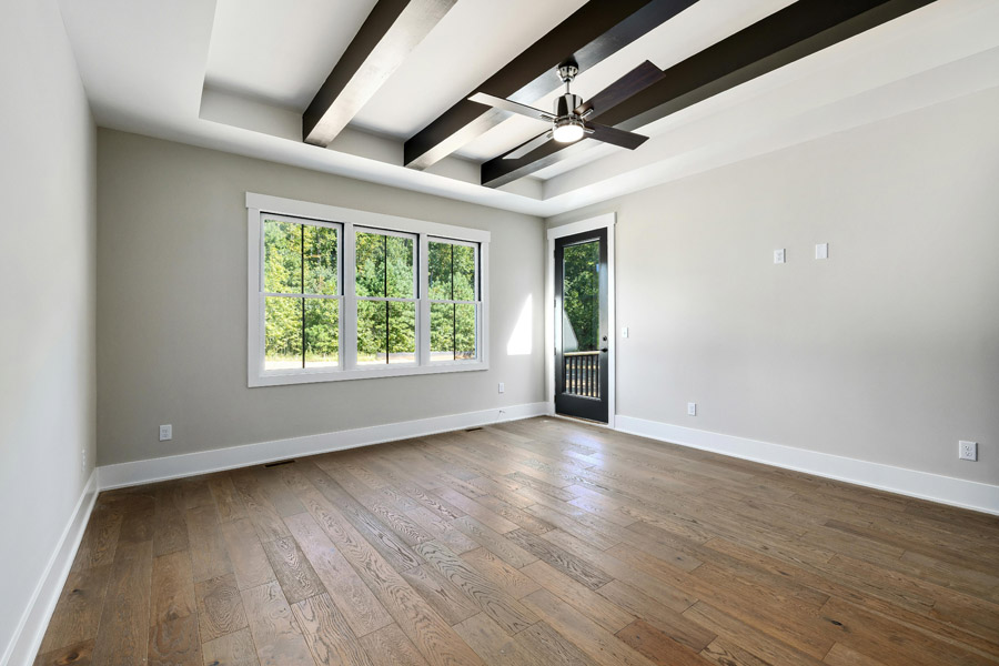 Empty modern room with eco-friendly painted beige walls and wooden floor