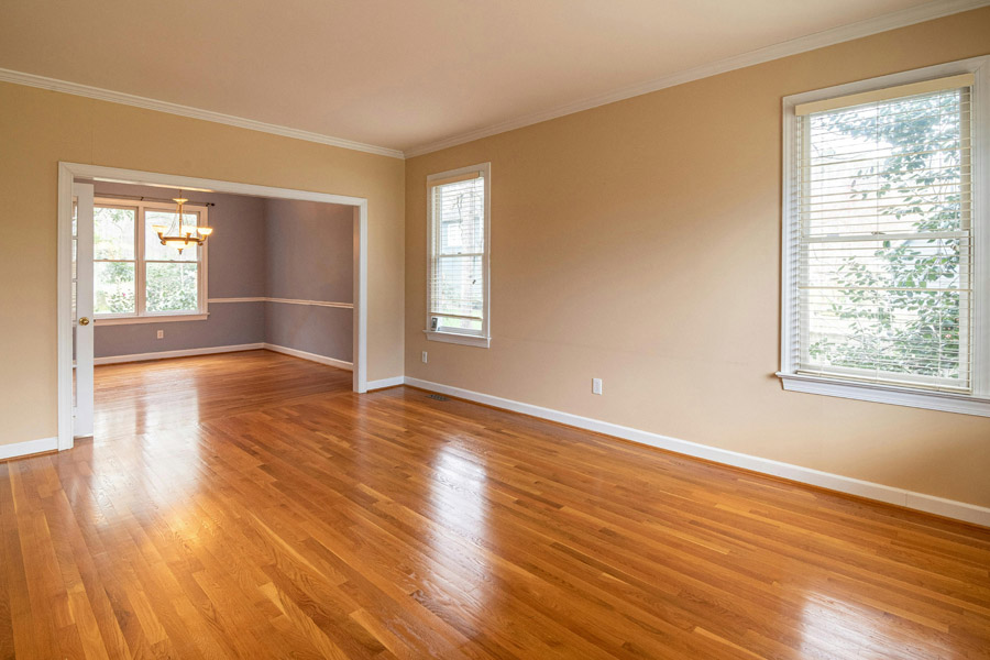 Eco-friendly beige and lavender painted living room with hardwood flooring