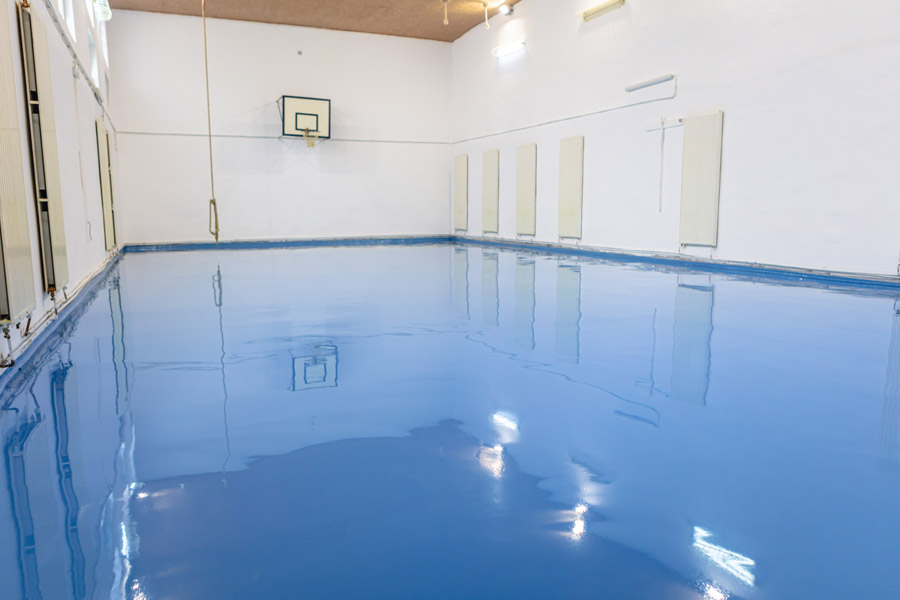 Blue epoxy floor coating Toronto — sports and gym flooring by Walls Master