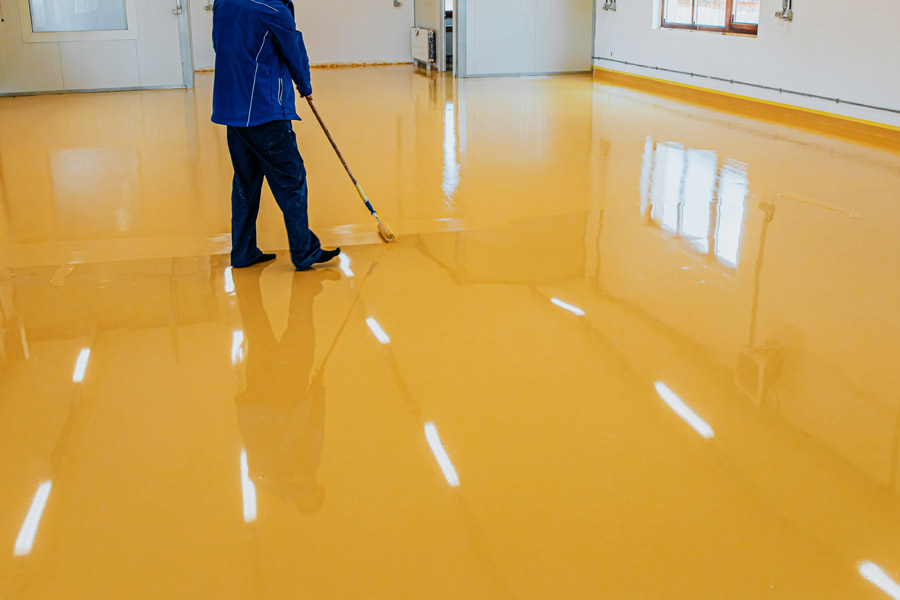 Epoxy floor coating Toronto — seamless yellow epoxy installation by Walls Master