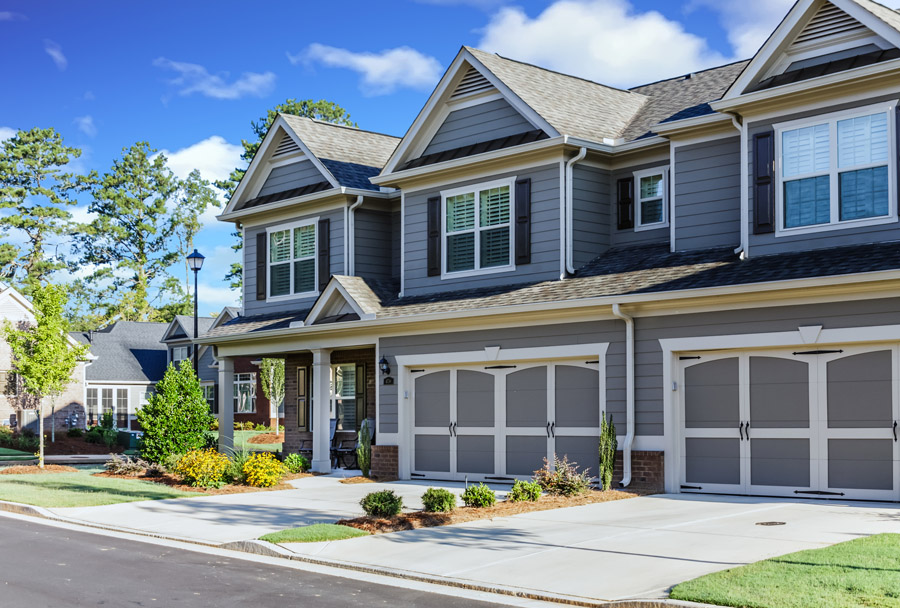 HOA exterior house painting Toronto — grey and white townhouse complex freshly painted by Walls Master