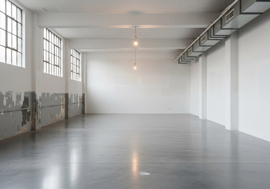Industrial painting Toronto — wall restoration and repainting in warehouse by Walls Master